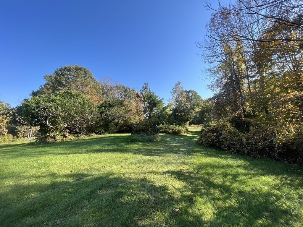 205 Lincoln Road Phillipston, MA 01331 - Photo 2 of 17 a view of a grassy field with trees