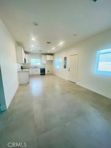 a view of a kitchen with a sink and cabinets