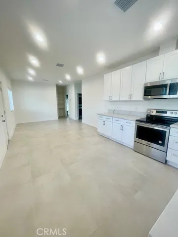 a large kitchen with cabinets