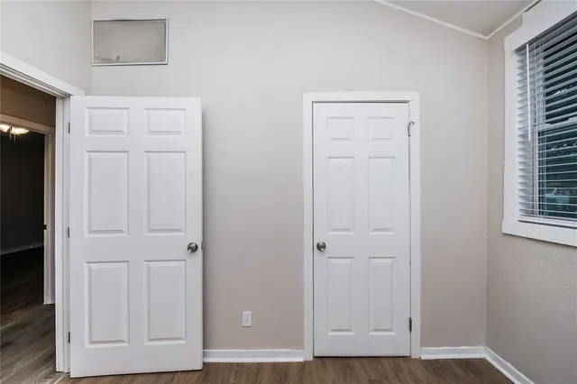 a view of room with hardwood floor