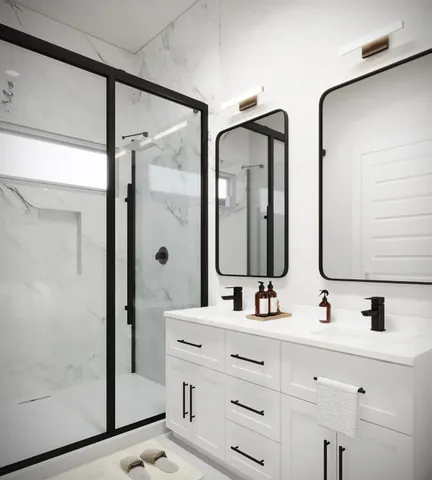 a bathroom with double vanity and a mirror