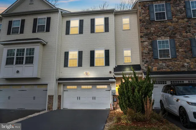 a view of a building with car parked