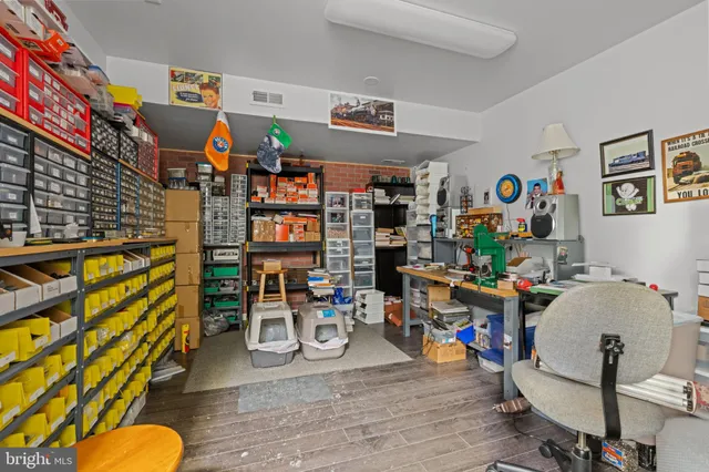 a view of a workspace with furniture and toys