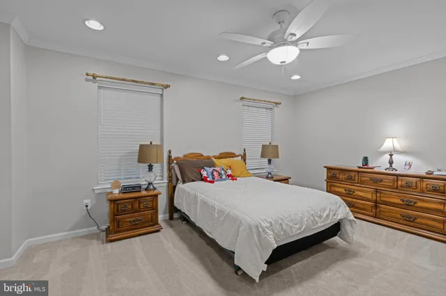 a bedroom with bed and a chandelier