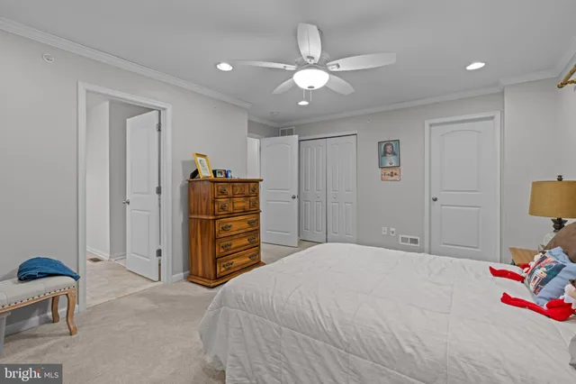 a bedroom with a bed and closet