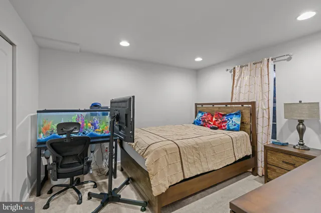 a bedroom with a bed and a desk