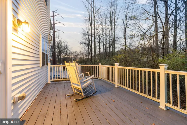 a view of a wooden deck with a bench