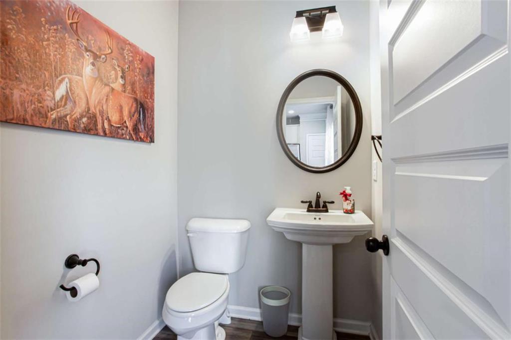 95 Bromes Street Lawrenceville, GA 30046 - Photo 22 of 37 a bathroom with a sink mirror and toilet