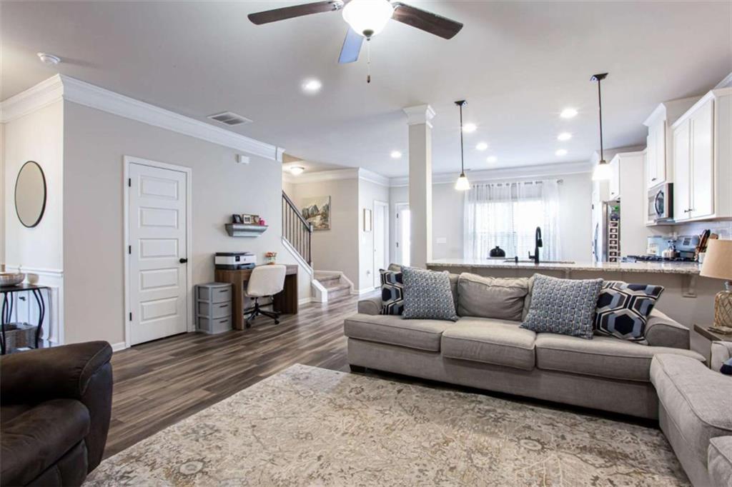 95 Bromes Street Lawrenceville, GA 30046 - Photo 3 of 37 a living room with furniture and a fireplace