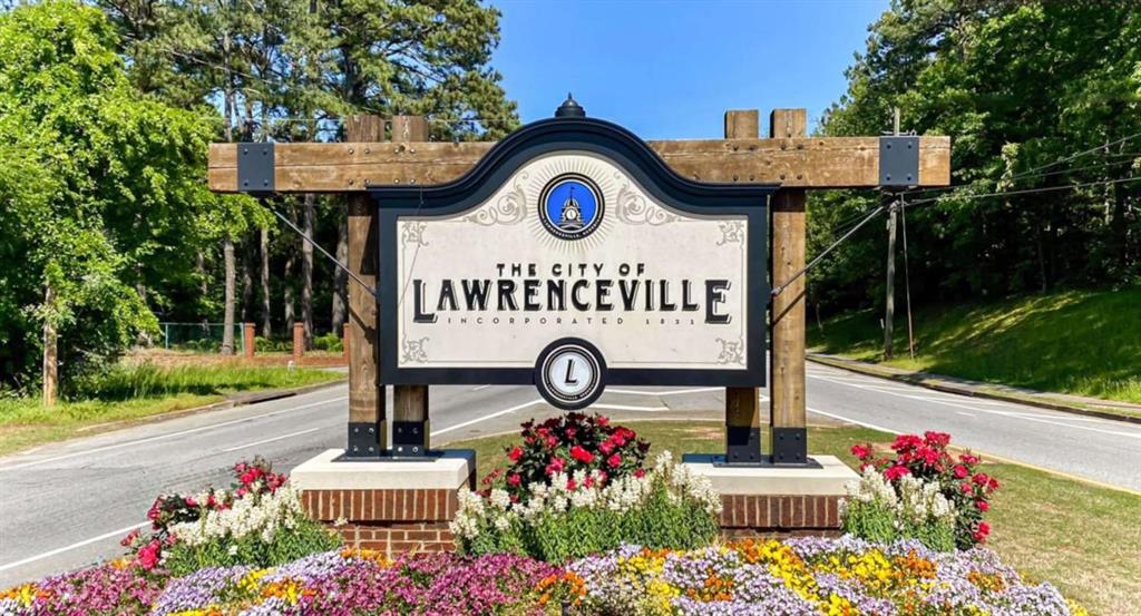 95 Bromes Street Lawrenceville, GA 30046 - Photo 33 of 37 a front view of a house with garden