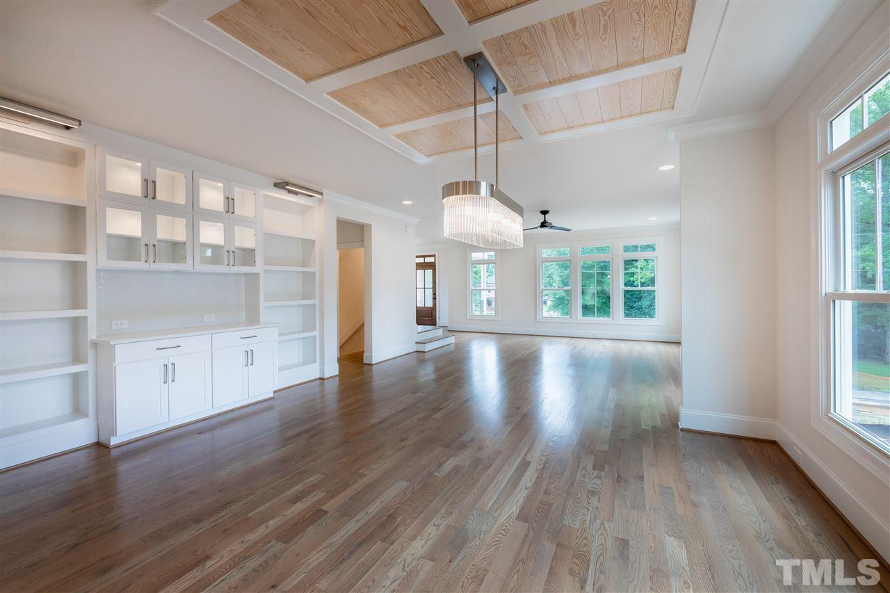 1439 Nottingham Road Raleigh, NC 27607 - Photo 11 of 23 an empty room with wooden floor and windows
