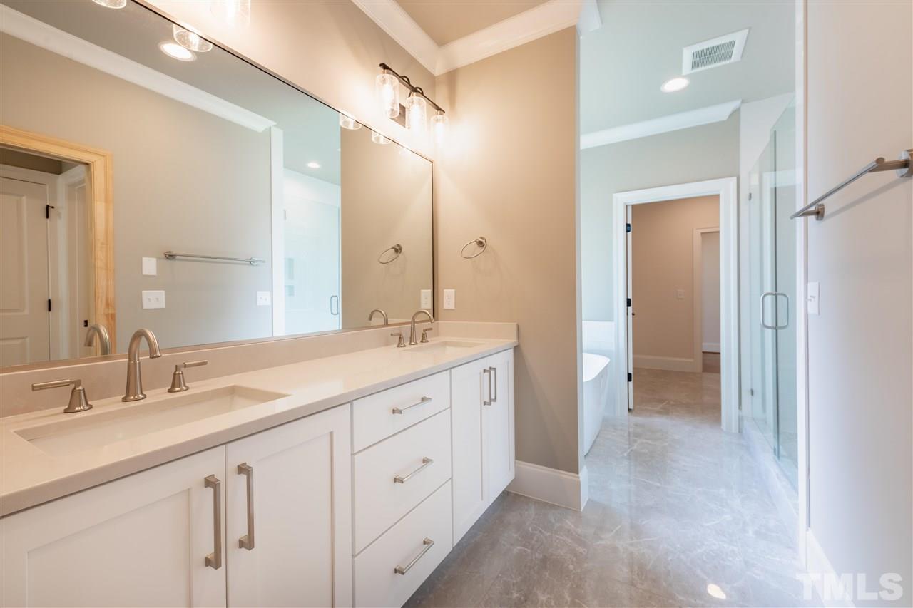 1439 Nottingham Road Raleigh, NC 27607 - Photo 13 of 23 a spacious bathroom with a double vanity sink mirror and double