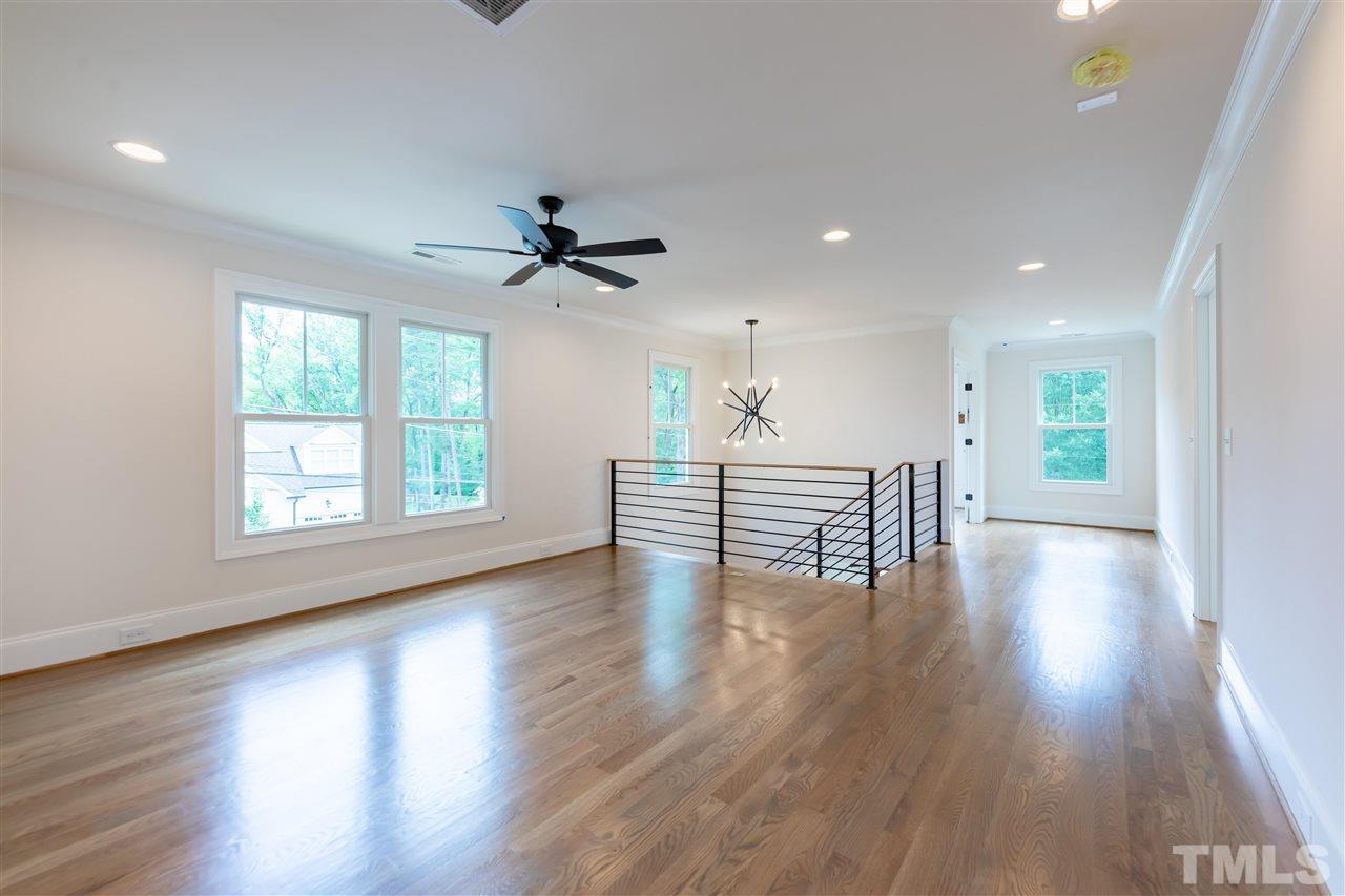 1439 Nottingham Road Raleigh, NC 27607 - Photo 17 of 23 a view of an empty room with wooden floor and a window
