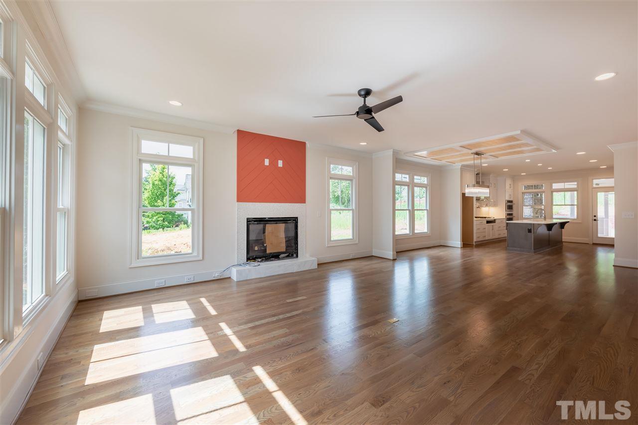 1439 Nottingham Road Raleigh, NC 27607 - Photo 8 of 23 a view of an empty room with window and wooden floor