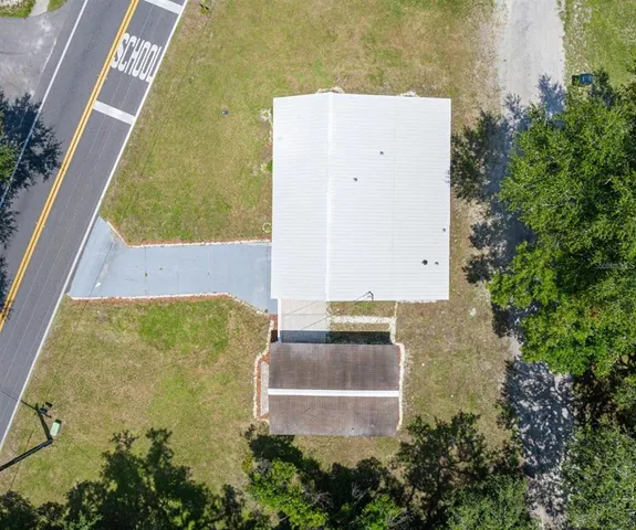 an aerial view of residential house with outdoor space