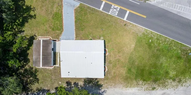 a view of a multi story building with yard