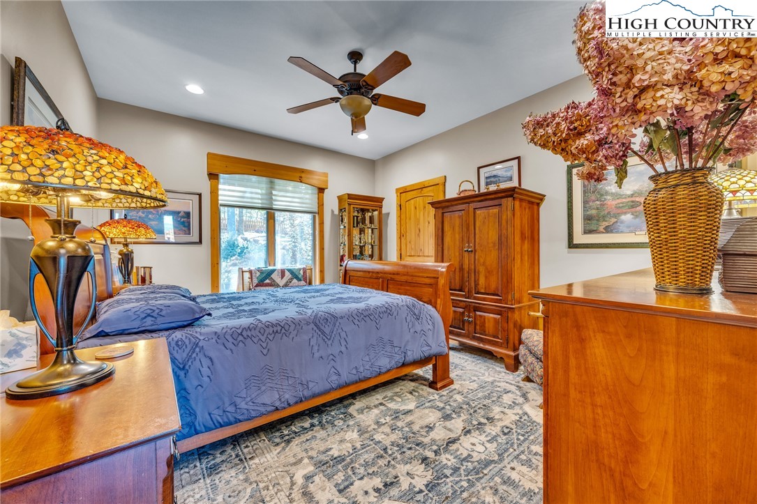 2650 Carson Woods Road Laurel Springs, NC 28644 - Photo 27 of 50 a bedroom with bed and wooden floor