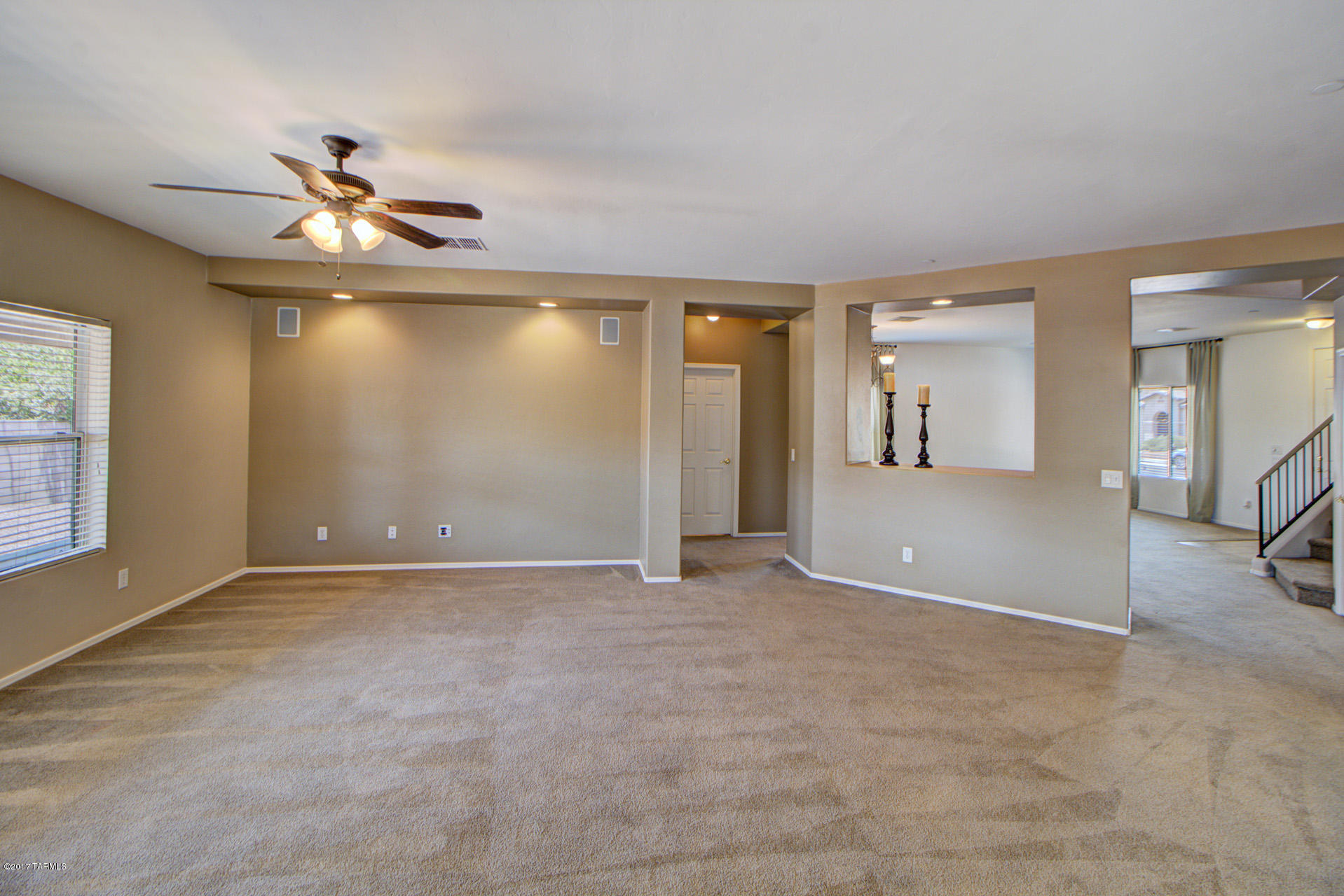 3588 East Mecate Road Tucson, AZ 85739 - Photo 7 of 36 an empty room with fan and windows