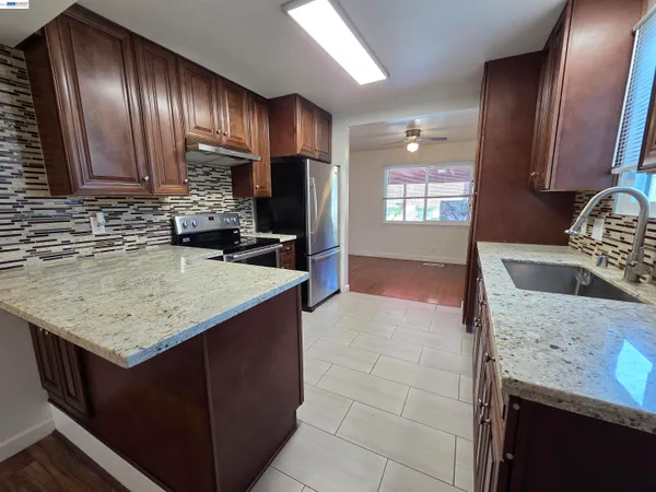 a view of a balcony with chair and wooden floor