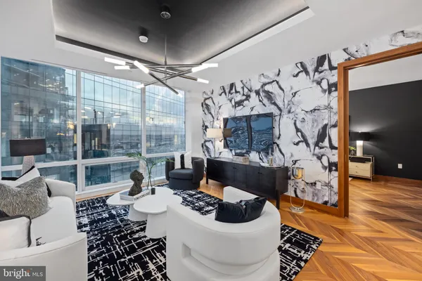 a living room with furniture and a flat screen tv