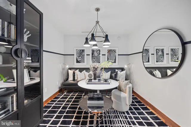 a dining room with furniture and a chandelier