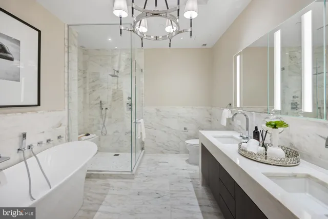 a bathroom with a tub sink and mirror
