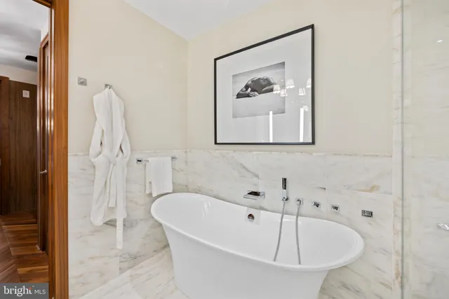 a bathroom with a tub and shower