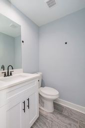 4349 Goins Road Nashville, TN 37211 - Photo 16 of 20 a bathroom with a sink a toilet and a mirror