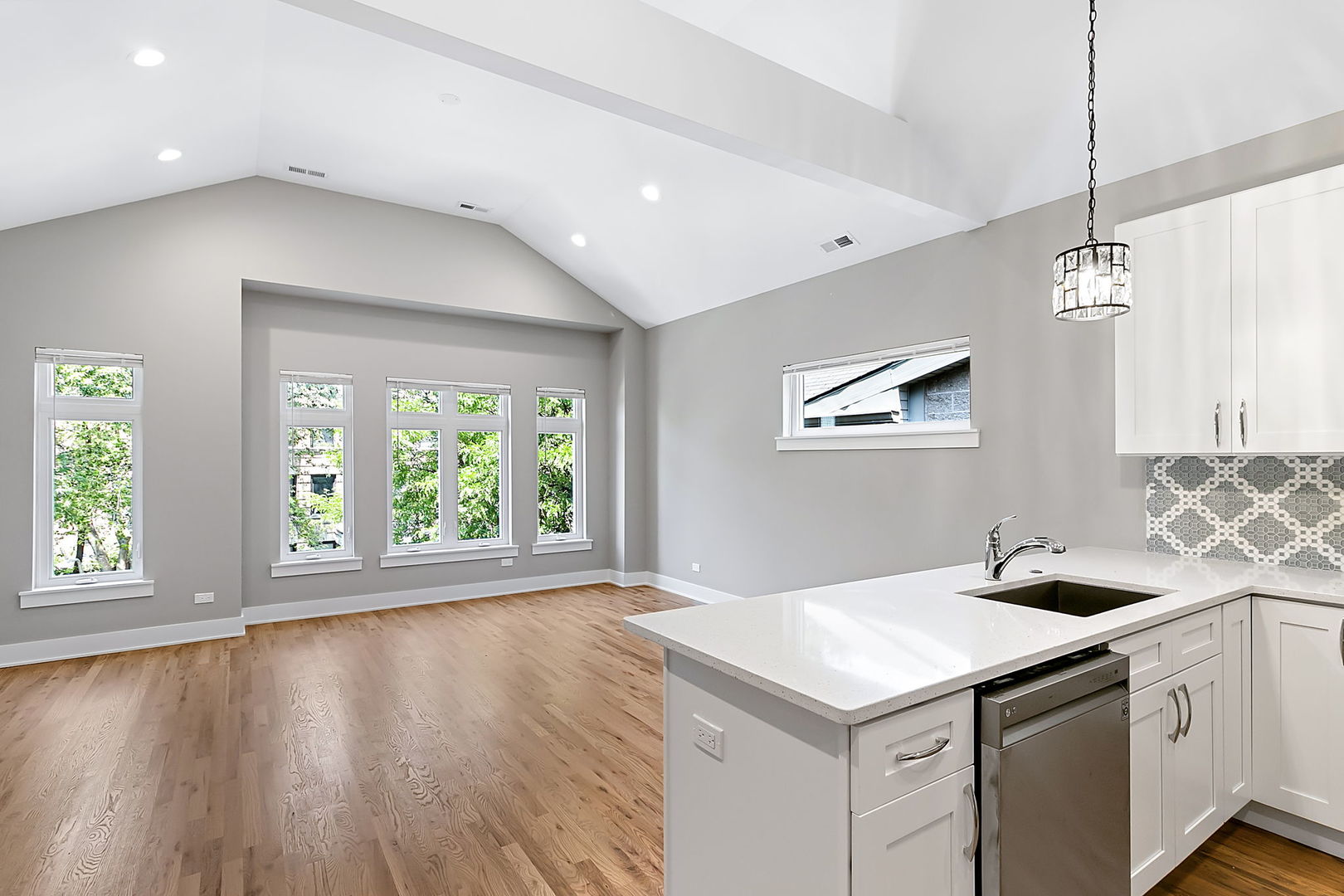 643 East 50th Street Chicago, IL 60615 - Photo 3 of 22 a kitchen with a stove window and wooden floor