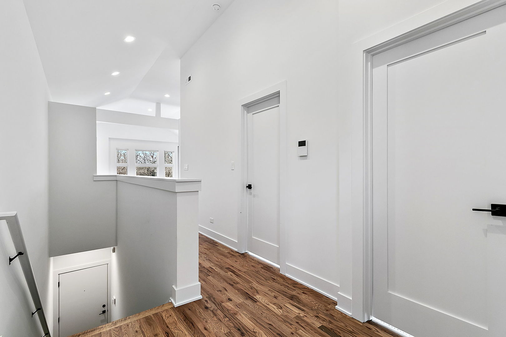 643 East 50th Street Chicago, IL 60615 - Photo 7 of 22 a view of a hallway with wooden floor and bathroom