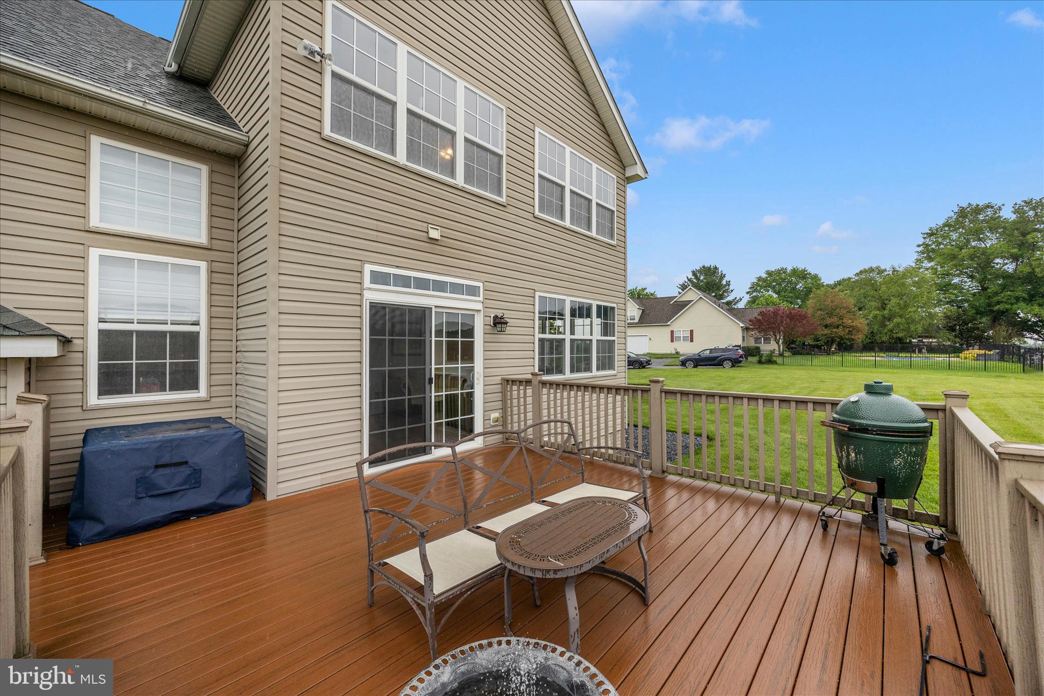 9855 McKinstry Mill Road New Windsor, MD 21776 - Photo 48 of 76 a view of a chair and table on the wooden deck