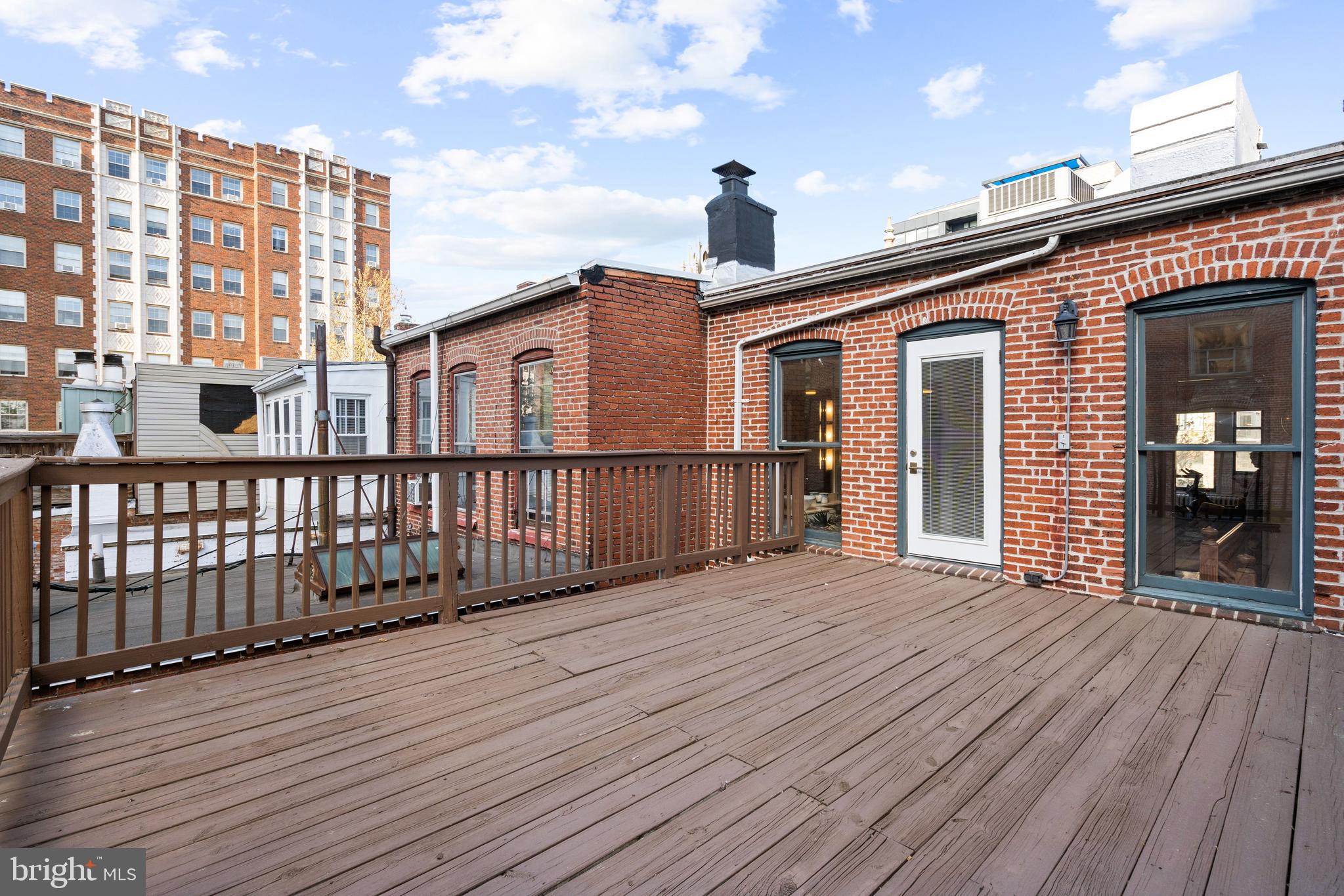 2026 15th Street Northwest Washington, DC 20009 - Photo 36 of 47 a view of a house with wooden deck