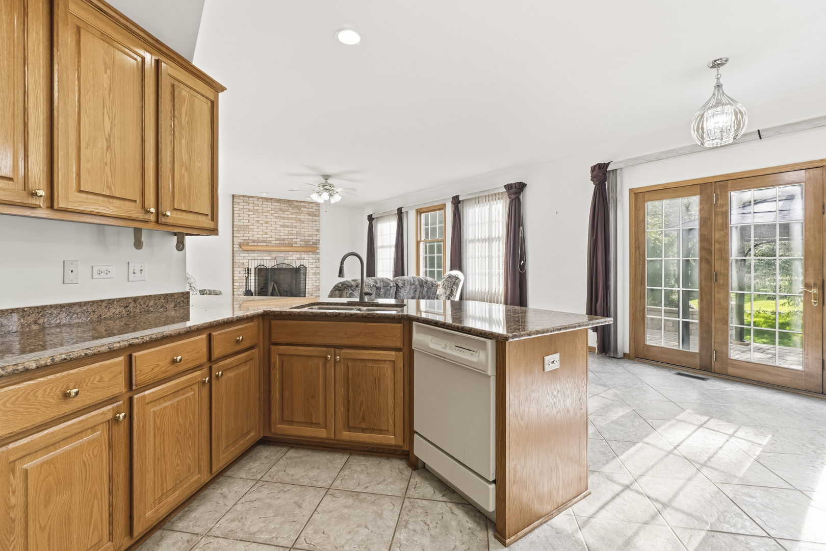 546 Fourth Avenue Addison, IL 60101 - Photo 11 of 39 a kitchen with stainless steel appliances granite countertop a stove a sink and a microwave