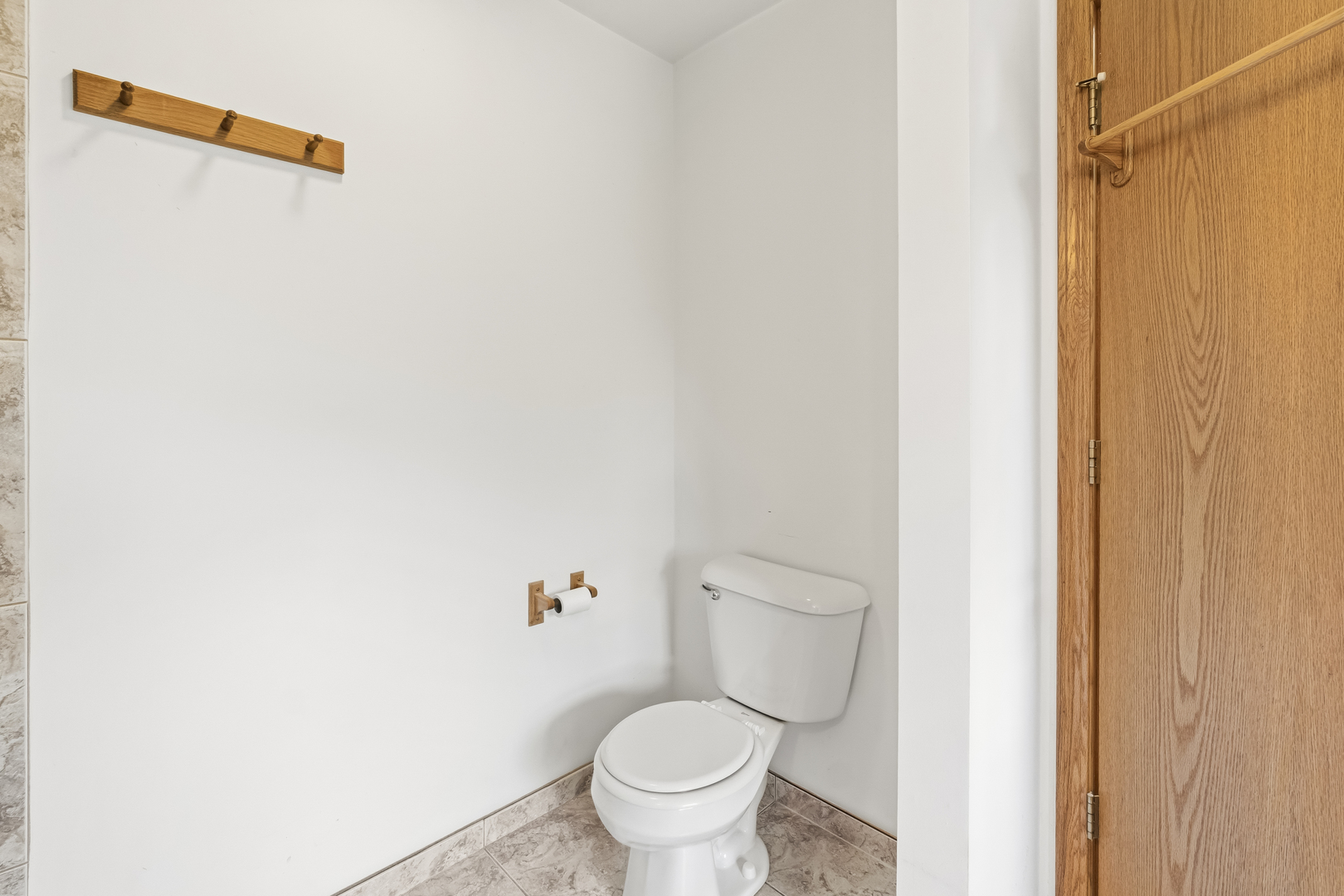 546 Fourth Avenue Addison, IL 60101 - Photo 20 of 39 a white toilet sitting next to a shower curtain