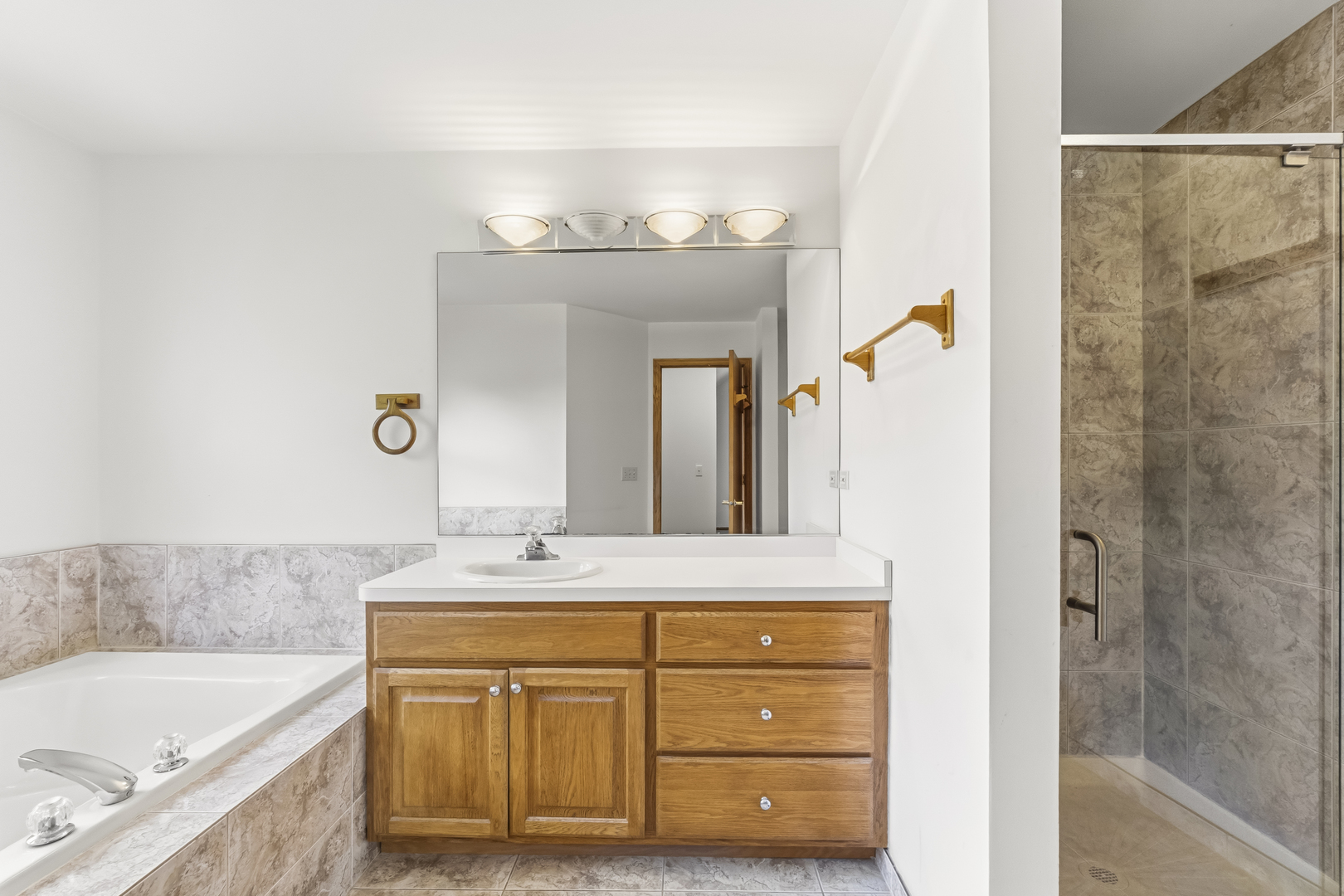 546 Fourth Avenue Addison, IL 60101 - Photo 22 of 39 a bathroom with a sink double vanity and a bathtub