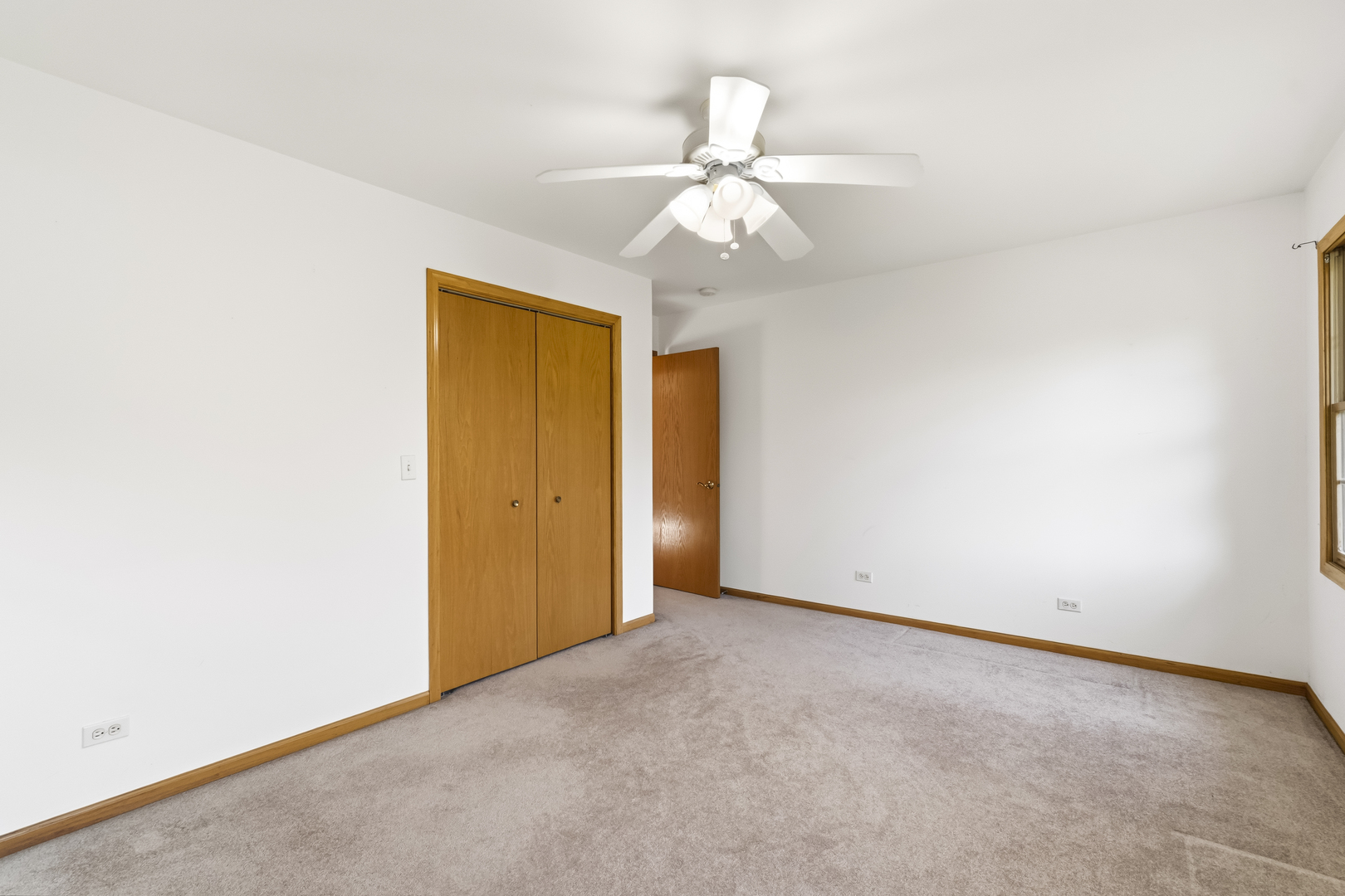 546 Fourth Avenue Addison, IL 60101 - Photo 31 of 39 an empty room with a chandelier fan and closet