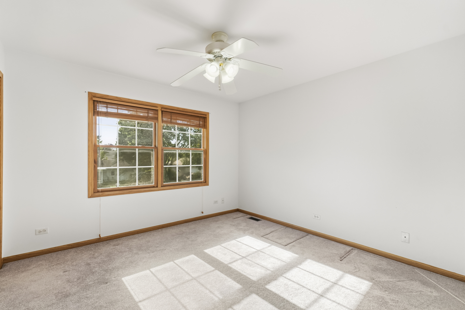 546 Fourth Avenue Addison, IL 60101 - Photo 33 of 39 an empty room with chandelier fan and windows