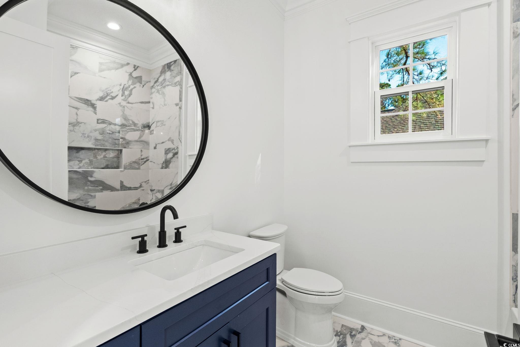 9282 Checkerberry Square Calabash, NC 28467 - Photo 21 of 40 Full bathroom featuring vanity and ornamental molding