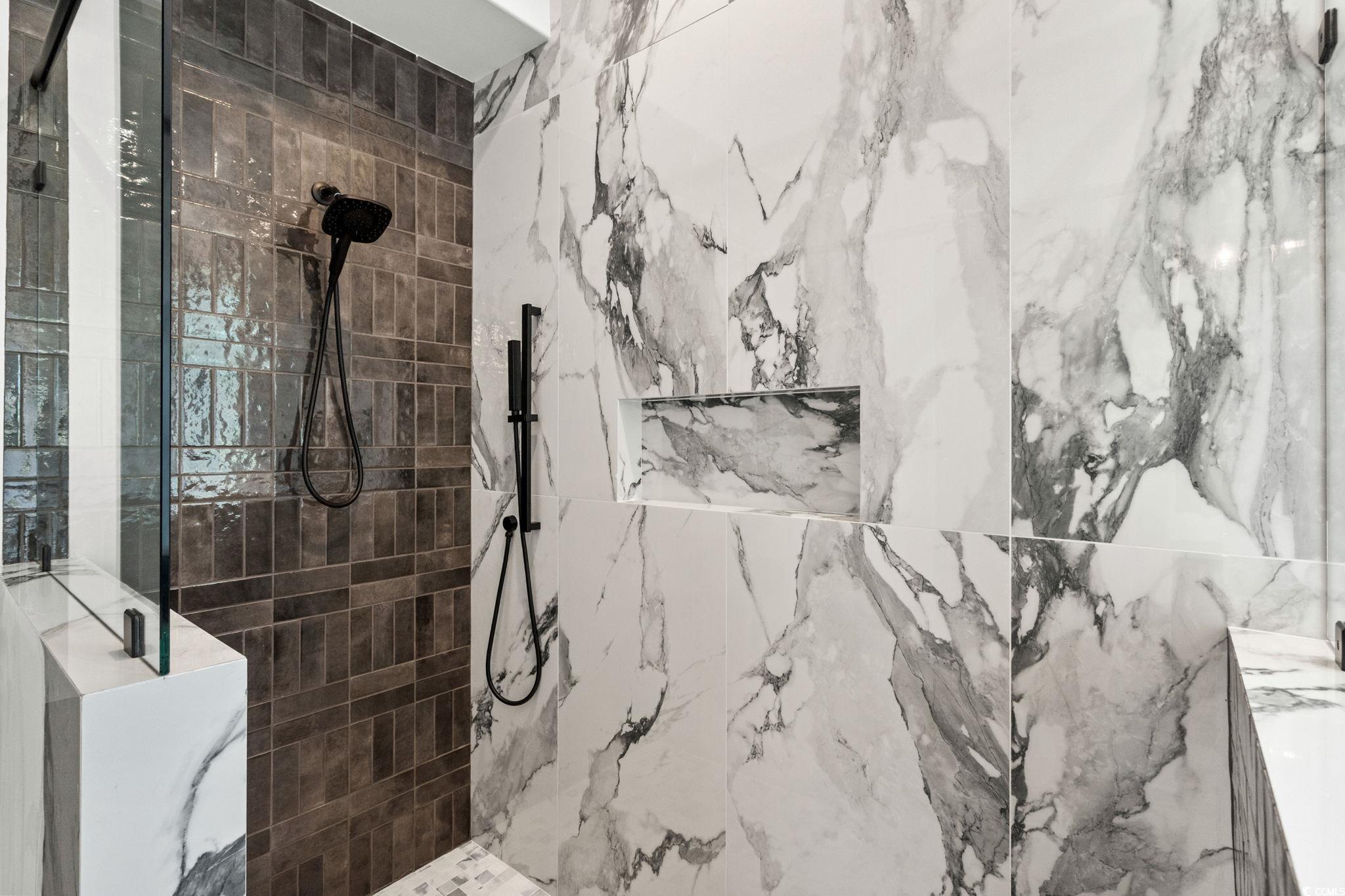 9282 Checkerberry Square Calabash, NC 28467 - Photo 27 of 40 Bathroom featuring a marble finish shower