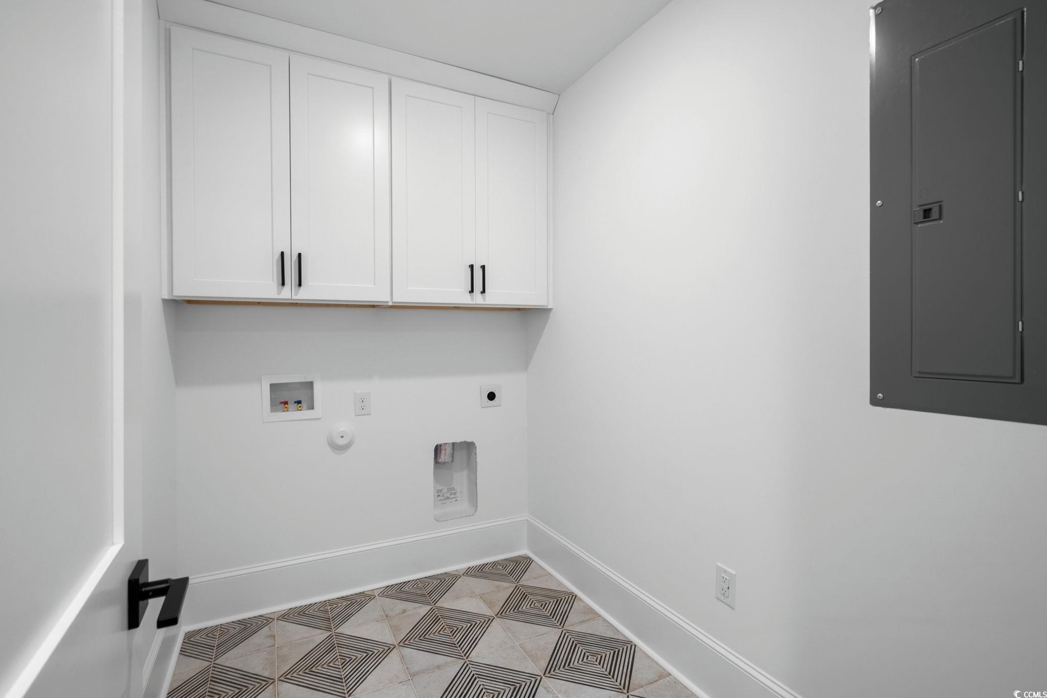 9282 Checkerberry Square Calabash, NC 28467 - Photo 28 of 40 Laundry area with electric panel, cabinet space, hookup for a gas dryer, hookup for a washing machine, and hookup for an electric dryer