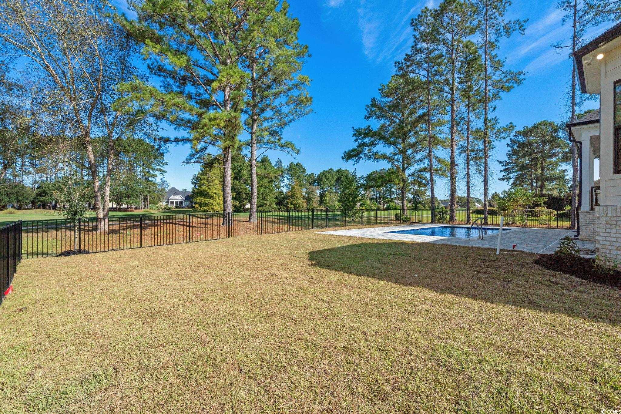 9282 Checkerberry Square Calabash, NC 28467 - Photo 34 of 40 Fenced backyard featuring a patio area