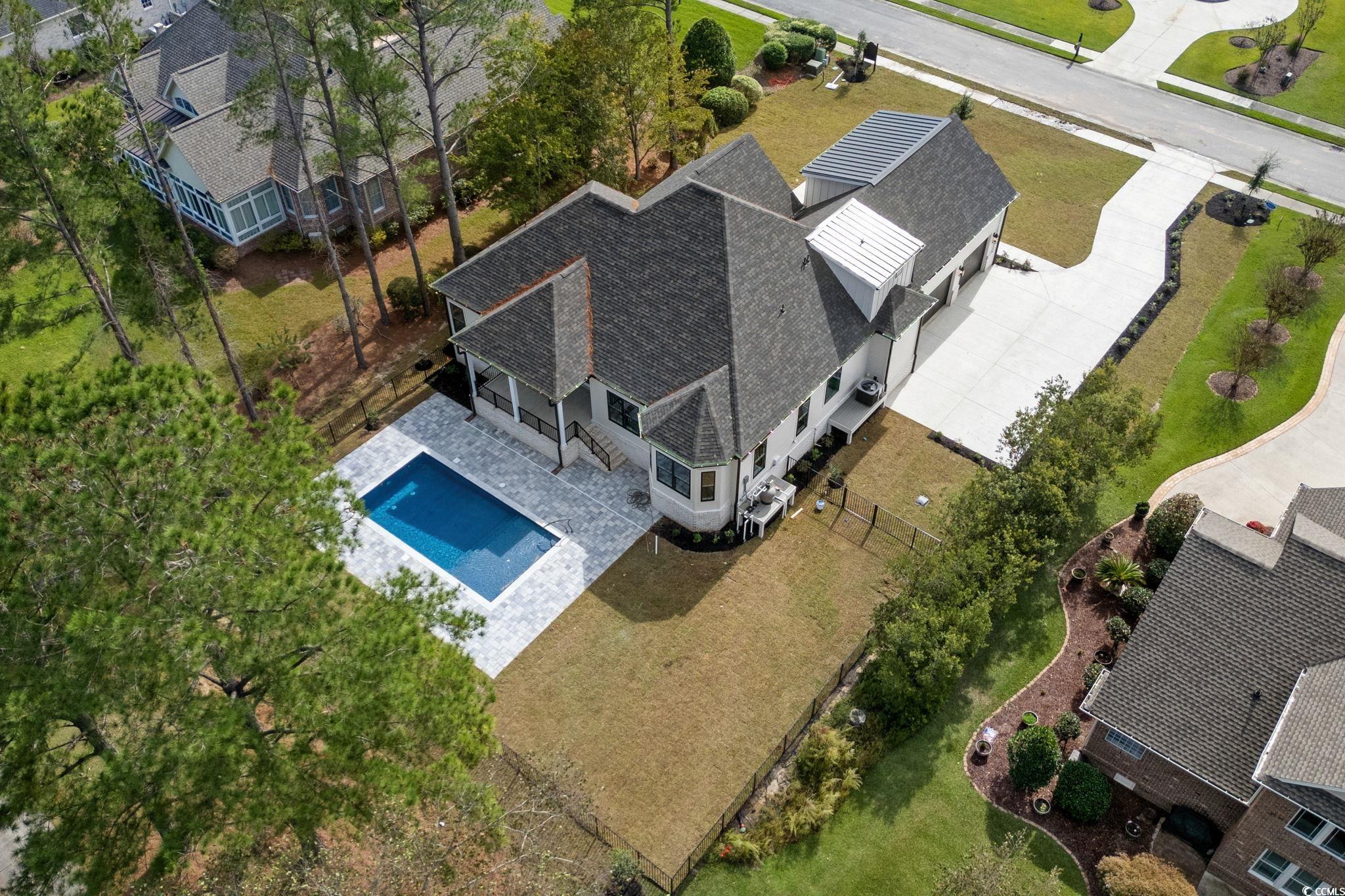 9282 Checkerberry Square Calabash, NC 28467 - Photo 35 of 40 View from above of property featuring a pool area