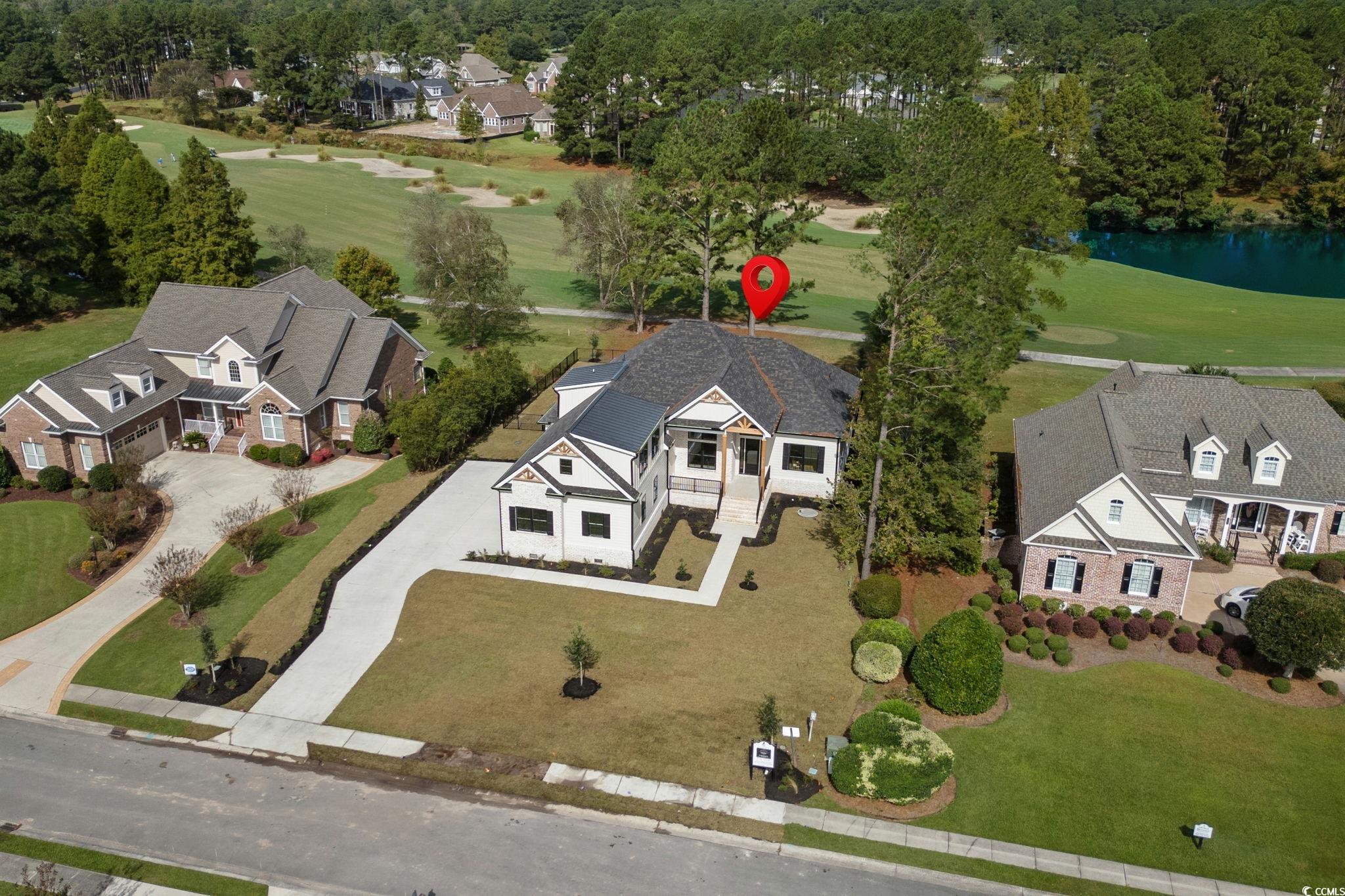 9282 Checkerberry Square Calabash, NC 28467 - Photo 37 of 40 Aerial view of residential area featuring a local golf course and a nearby body of water