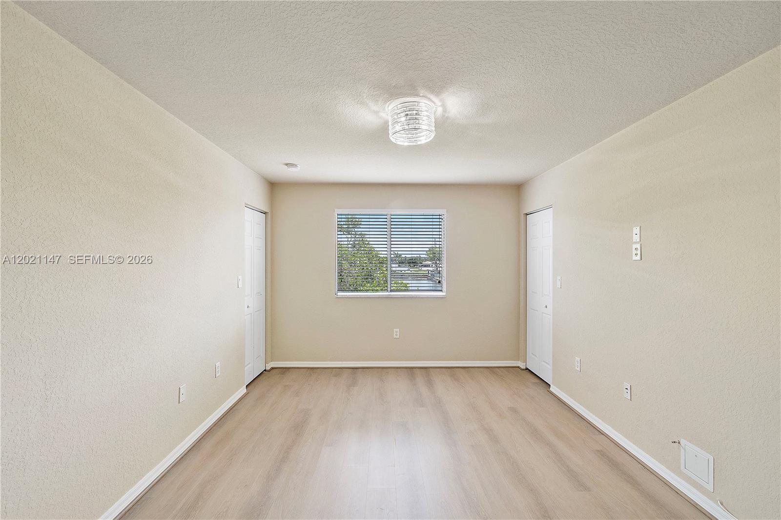 5930 Abbey Road Tamarac, FL 33321 - Photo 13 of 26 an empty room with a window