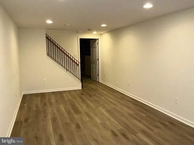 a view of hallway with wooden floor