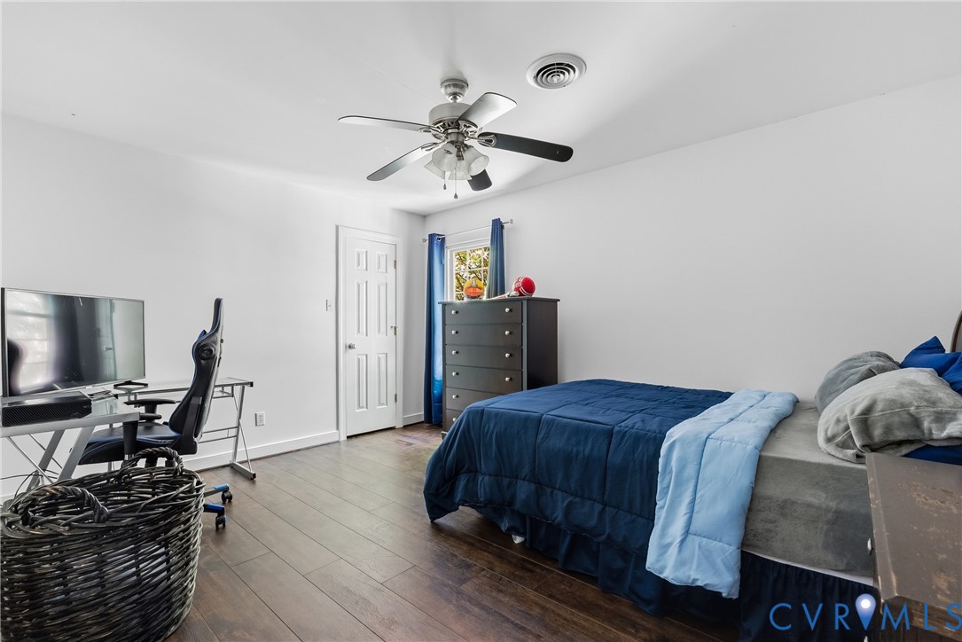 14321 Crossings Ridge Drive Midlothian, VA 23113 - Photo 26 of 43 a bedroom with a bed and wooden floor
