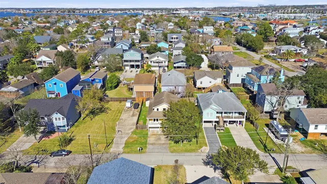 an aerial view of residential houses with outdoor space
