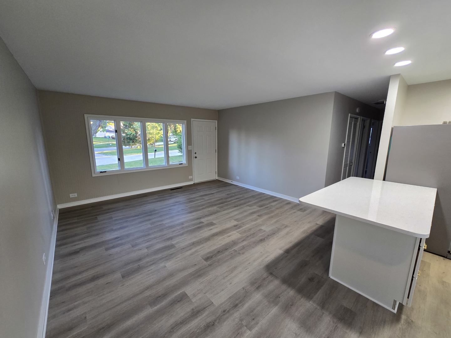 60 South Seebert Street Cary, IL 60013 - Photo 5 of 14 an empty room with wooden floor and windows