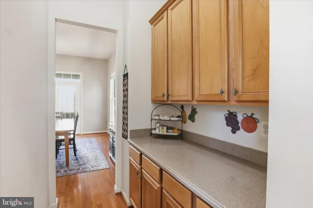 a kitchen with a sink a stove and cabinets