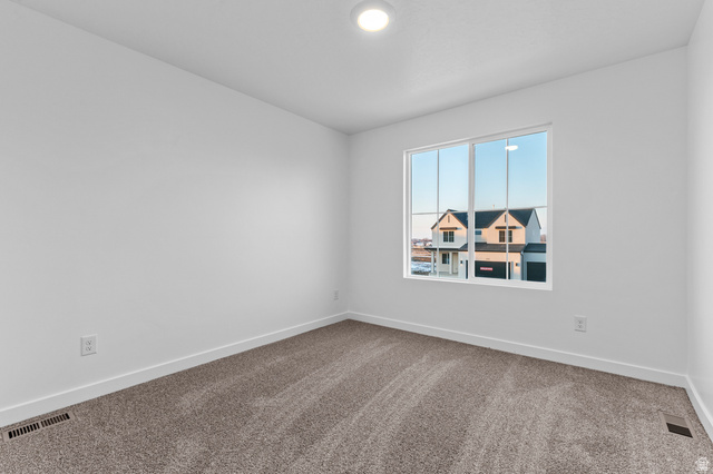 2829 North 710 West, Unit 15 Logan, UT 84321 - Photo 22 of 23 Neutral interior with grey carpet flooring and white baseboards